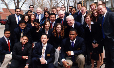 WCE students, staff and faculty with Warren Buffett