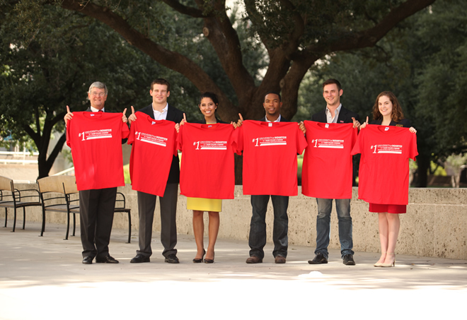 UH Bauer Dean’s Executive Board chairman Richard Rawson, left, and entrepreneurship students who attended the Sept. 22 announcement at City Hall celebrated the ranking with commemorative T-shirts boasting “#1” across the chest.