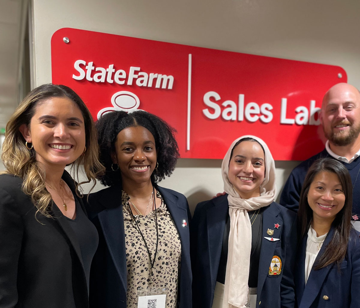 Photo: Program for Excellence in Selling Director and team coach Yara Suki, marketing senior Toni Gilmore, marketing and management senior Dana Fattouh, State Farm person and Stagner Sales Excellence Institute Director of Corporate Relations and team coach John Pingel.