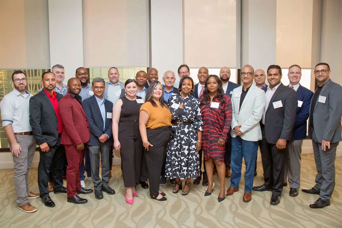 Group shot of the Fall 2023 DBA Cohort from the Welcome Reception at The Houston Club.