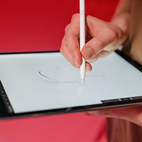 Photo: Artist drawing on tablet