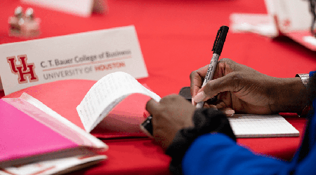 Photo: Conference attendee taking notes