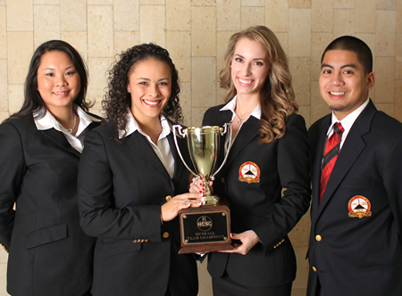 PES winning team 3-10_70 Photo: Marketing students Taylor Herbert and Rebekah Elliott, center left and center right, competed in the National Collegiate Sales Competition and took home the first place trophy, with Jozette Bionat and Adrian Sese serving as team alternates.