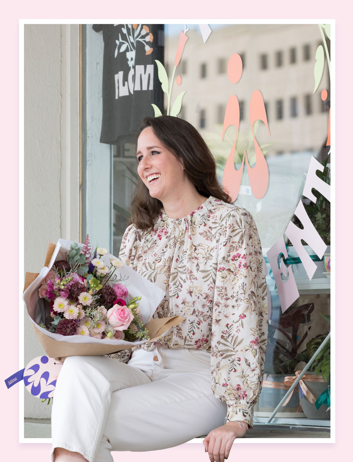 Photo: Bauer College MBA alumna and florist Thalia Jaguande holds a bouquet of flowers and smiles at her business Isidora Flower & Gift Shop in Houston's Rice Village.