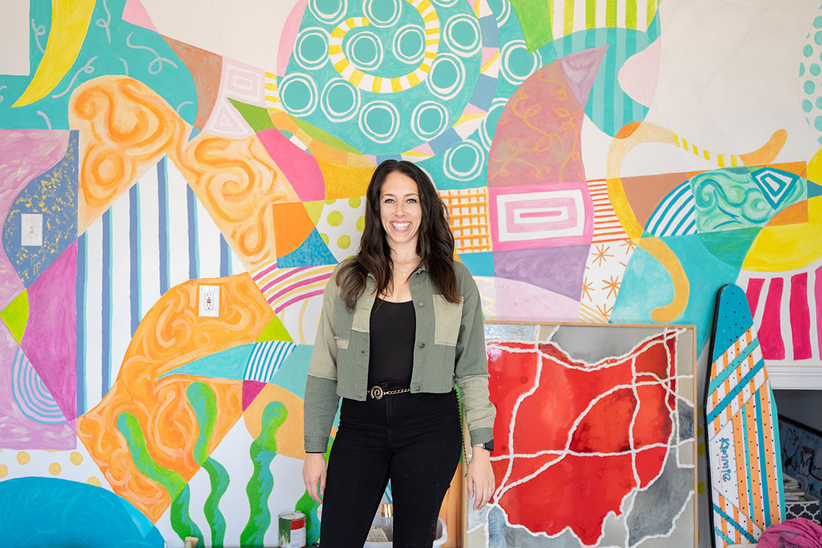 Photo: Kimberly Gillespie in front of mural