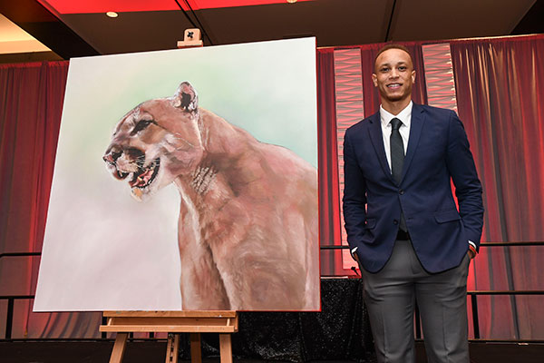 Photo: Tim “Sketchbook” Walker with his Cougar painting