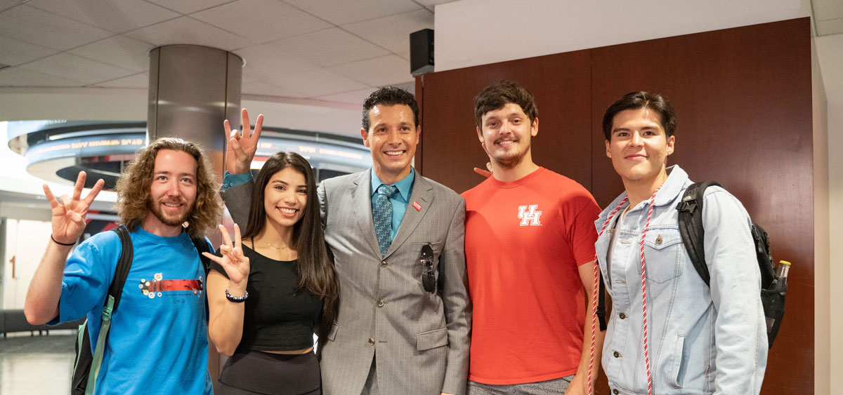 Photo: Bauer College Dean Paul A. Pavlou (center) visited with undergraduate students who plan to graduate this fall during Graduation Orientation.